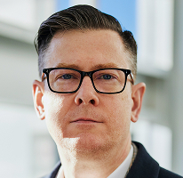 Kryptovaluuttakauppaa johtavan yrityksen toimitusjohtajan Alexander Hughesin muotokuva